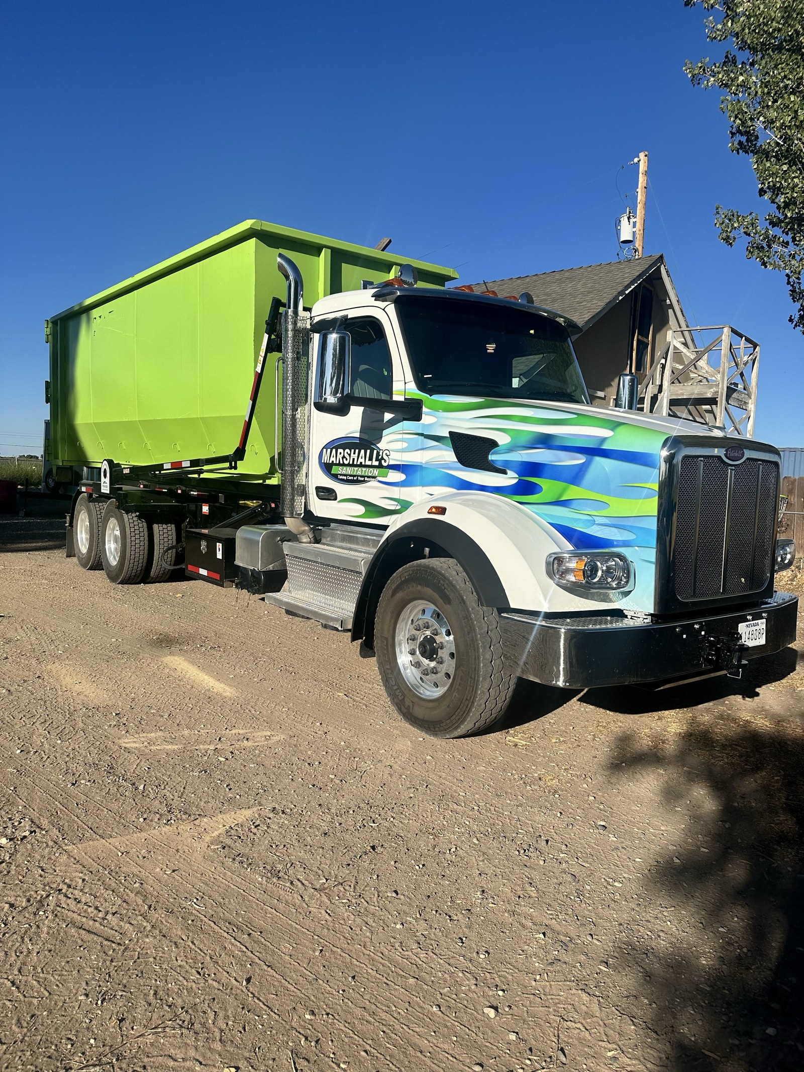 Marshall's Sanitation truck parked on a Nevada dirt road